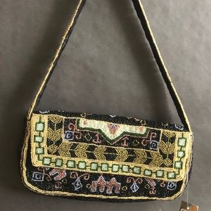 Hand beaded bag with silk lining